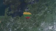 istock Lithuania map with Lithuanian flag, zooming out into the space through a photo real animated globe, with a panoramic view consisting of Asia, Africa and Europe. Realistic 4K epic spinning world animation, Planet Earth half day and night rotating, 1419357757