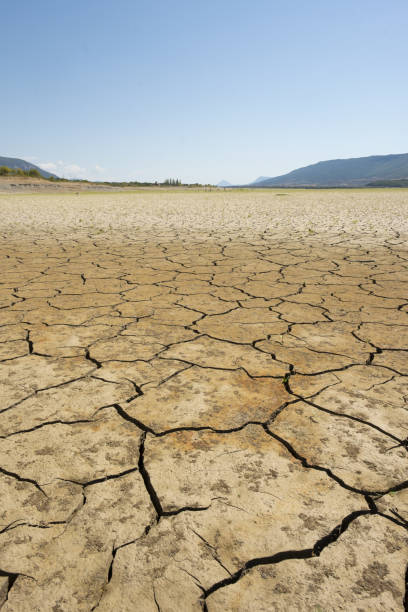 istock Drought in the cracked earth, climate change concept. 1419358225