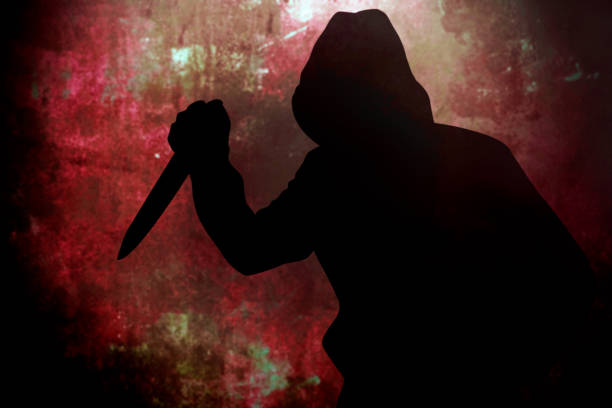 istock Silhouette criminal holding knife 1419358617
