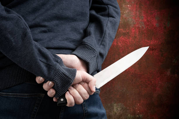 istock Silhouette criminal holding knife 1419358632