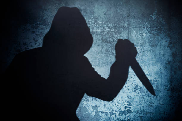 istock Silhouette criminal holding knife 1419358658