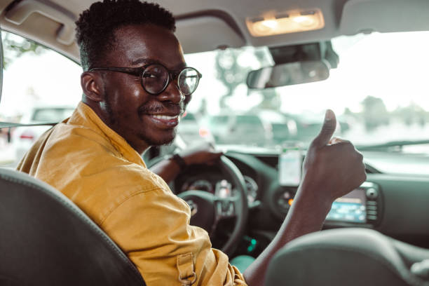 istock African-American young man on a driver seat 1419363370