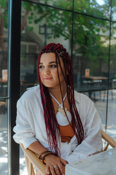 istock Joyful cute good looking young woman with dreadlocks, freelancer, working remotely 1419364046