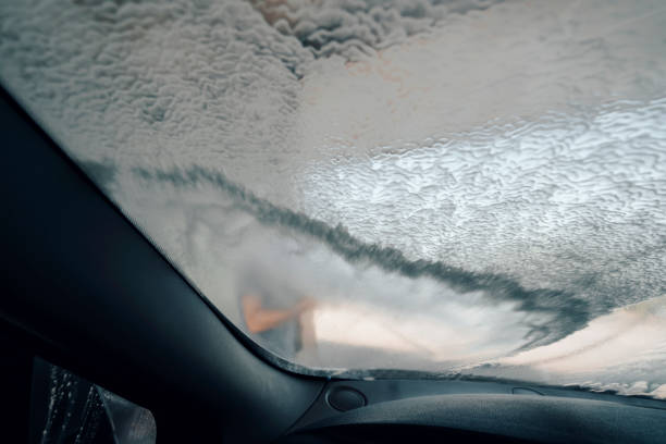 istock Young man washing car 1419365109