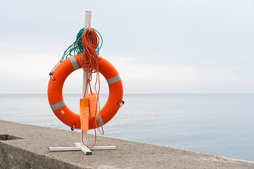 Lifebuoy on the background of the sea horizon.