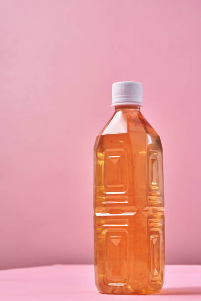 istock Plastic Bottle of Ice Tea on Vibrant Background 1419370741
