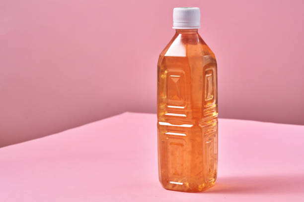 istock Plastic Bottle of Ice Tea on Vibrant Background 1419370753