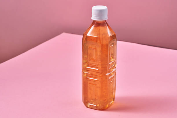 istock Plastic Bottle of Ice Tea on Vibrant Background 1419370755