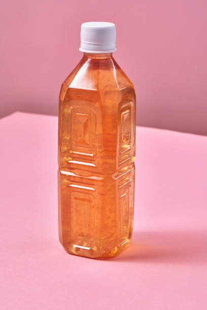 istock Plastic Bottle of Ice Tea on Vibrant Background 1419370776
