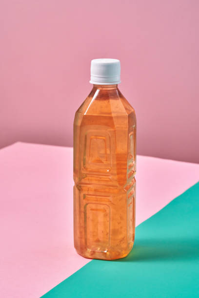 istock Plastic Bottle of Ice Tea on Vibrant Background 1419370777