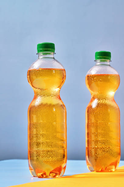Plastic Bottle of Apple Soda on Vibrant Background