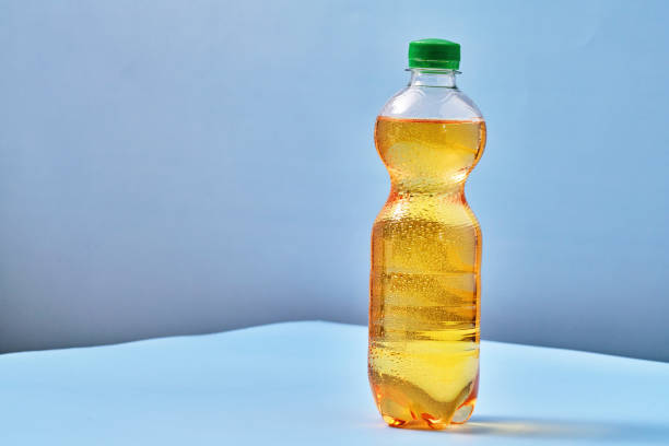 istock Plastic Bottle of Apple Soda on Vibrant Background 1419370954