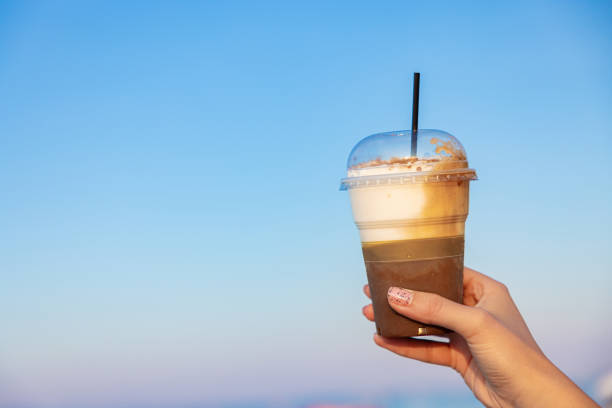 istock Unrecognizable woman holding plastic cup woth iced coffee 1419371759