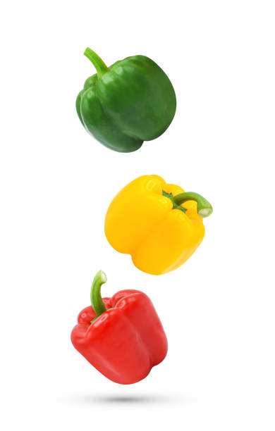 istock Bell peppers falling in the air isolated on white 1419375753