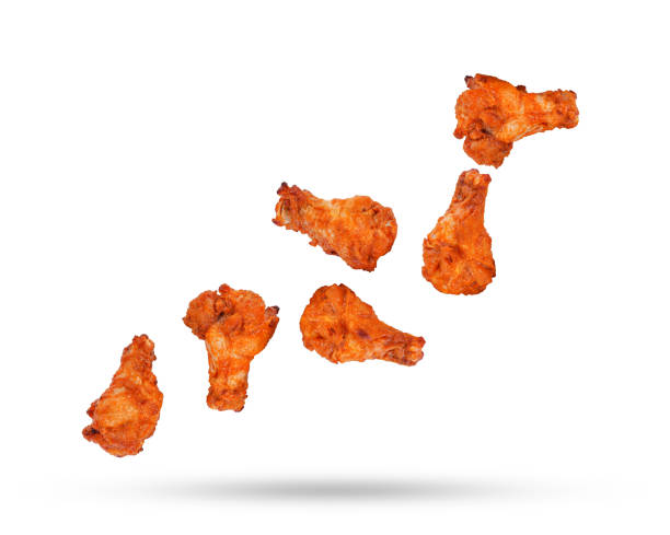 istock Barbecue chicken falling in the air isolated on white 1419375812