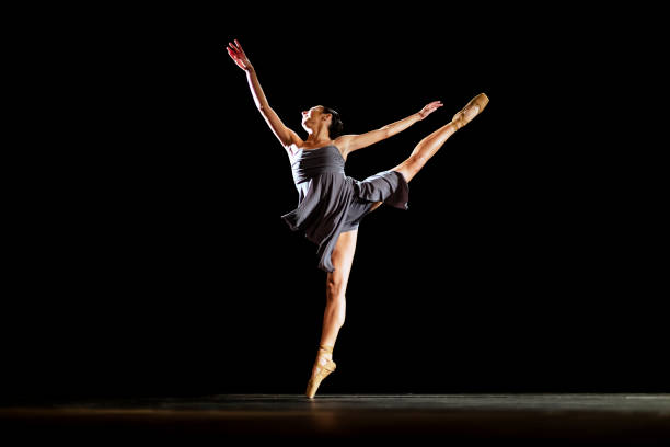 istock Girl dancing neoclassic ballet on dark stage 1419376170