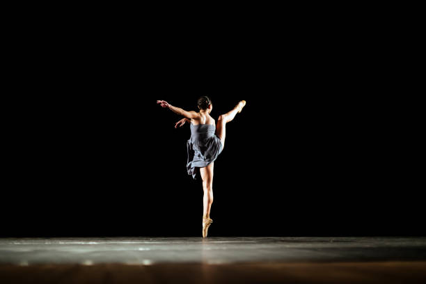 istock Girl dancing neoclassic ballet on dark stage 1419376191