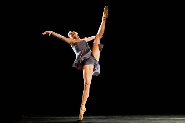 istock Girl dancing neoclassic ballet on dark stage 1419376227