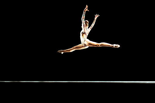 Young ballerina performing on a stage theater