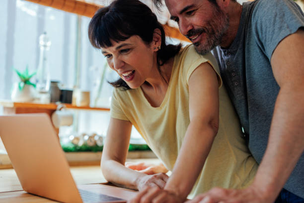 istock Middle aged couple looking for vacation online 1419376358