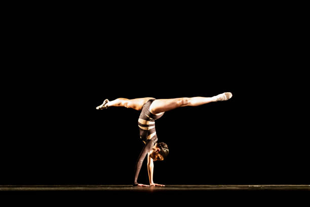 istock Girl performing contemporary dance on dark stage 1419376362