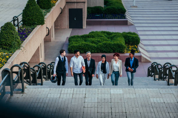 istock Business team walking on steps in city 1419377585
