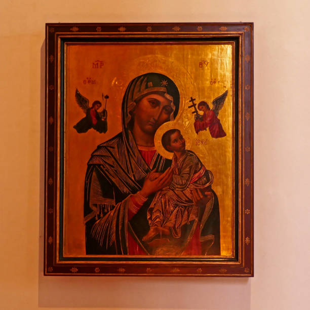Rheine, NRW, Germany - August 24 2022 Art in the St. Dionysius church. Icon of mother Mary and child Jesus with gold coloured background. Mother of Perpetual Help.