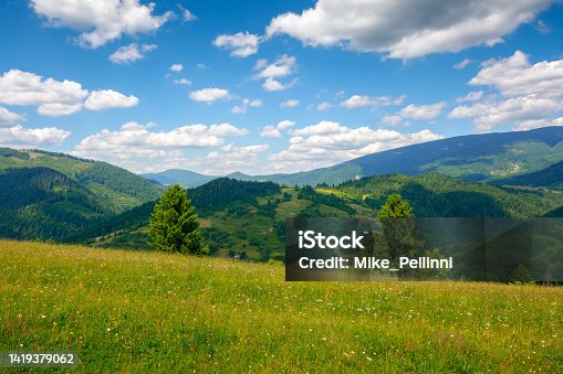 istock green field on the hill in mountains 1419379062