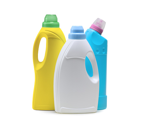 Household cleaning products in plastic bottles isolated on a white background. Colorful plastic bottles product mockup.