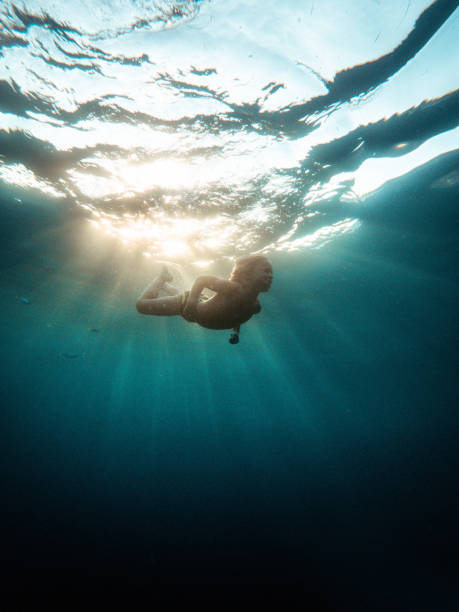 istock Adventurous Child Swimming Underwater While On Summer Holidays 1419386779