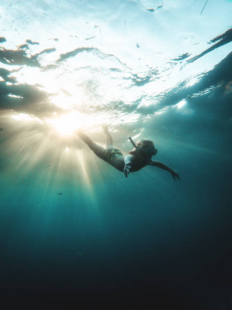 istock Young Caucasian Boy Diving Underwater In Turquoise Colored Water 1419386782