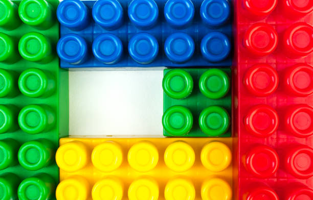 Lot of colorful rainbow toy bricks background. Educational toy, constructor for children Isolated on white background. 3D Rendering. Top view with copy space