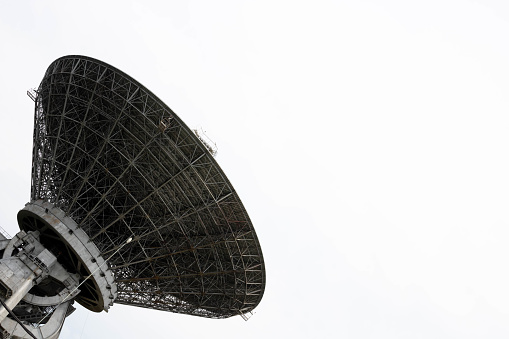 Huge white satellite dish under the starry sky