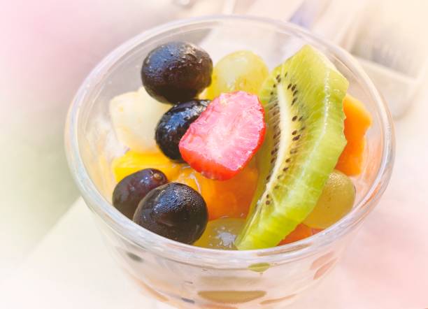 istock Fruit salad served in a glass cup close-up. 1419395713