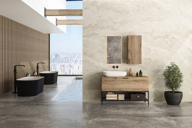 istock Bright bathroom interior with concrete floor, two black bathtubs 1419396498