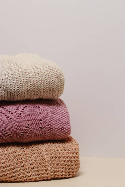 istock stack of folded knitwear, minimal lifestyle, capsule wardrobe, copy space 1419407775