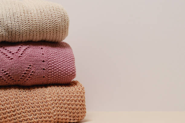istock stack of folded knitwear, minimal lifestyle, capsule wardrobe, copy space 1419407776
