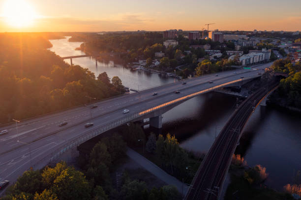 Traffic on highway E18 in Stockholm between Danderyd and Solna municipalities at sunset.