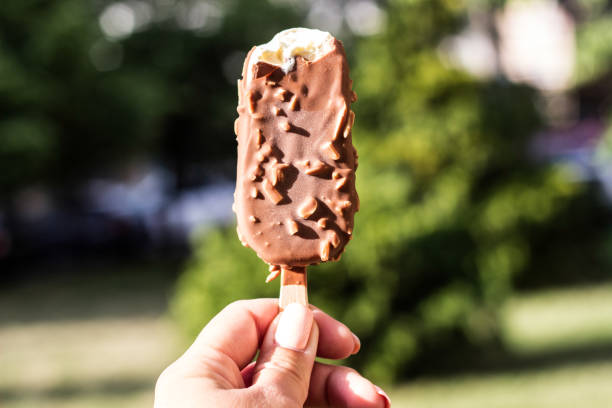 istock Woman holding chocolate ice cream 1419413662