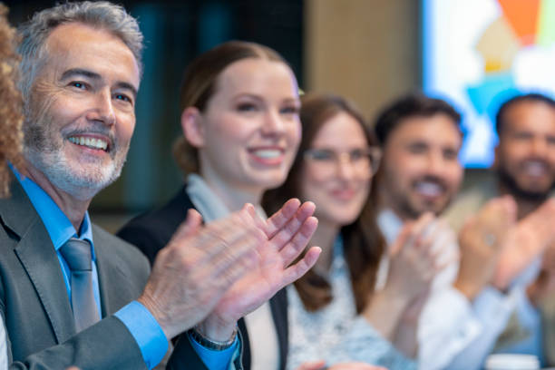 istock Group of business people applauding a presentation. 1419416413