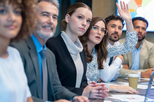 istock Businesswoman raising her hand. 1419416417