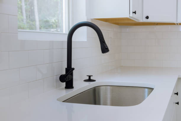 istock Home improvement with installed new kitchen cabinets view water tap sink in kitchen 1419419797