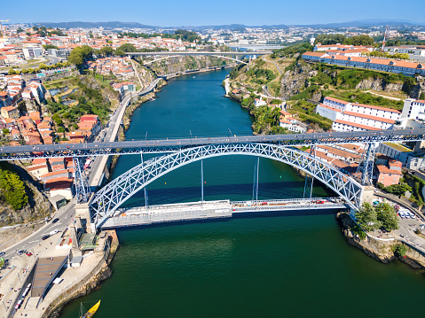 A scenic view of the Douro River with three bridges (Luis I Bridge in the foreground).