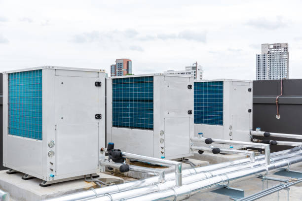 istock Air conditioner compressor installed on roof building. Industrial air conditioning units. Industrial air conditioning and ventilation systems on roof. Cooling towers in data center building. 1419422524