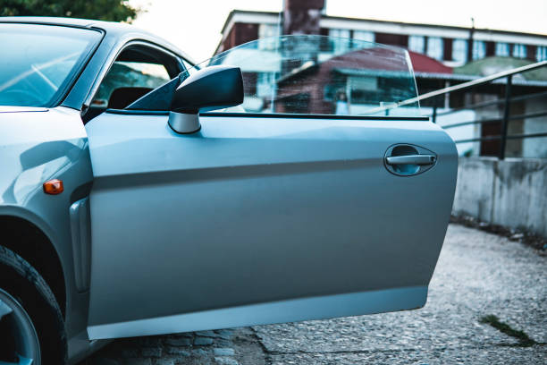 Image of open doors of a gray sports car