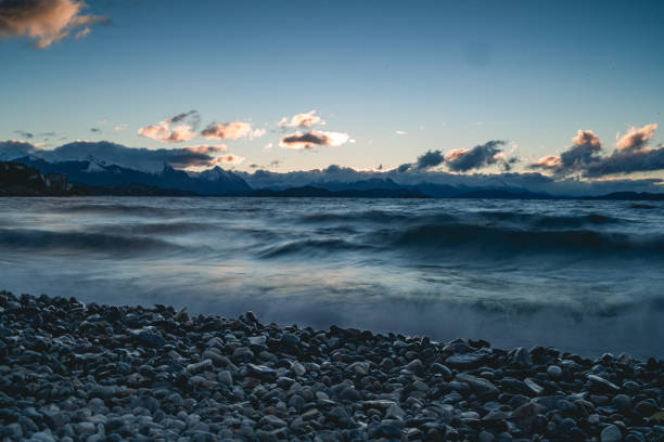 rocks in the water in a nostalgic and beautiful sunset