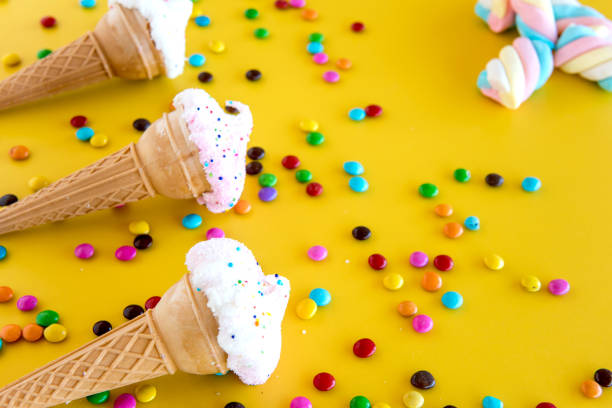 istock Colored Candies for Children's Day on yellow background 1419428227