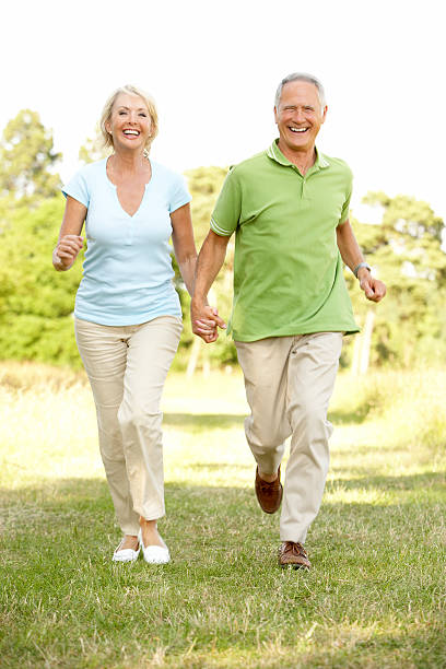 istock Mature couple walking in countryside 141943214