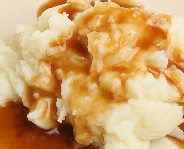 Mashed Potato and Gravy Mashed potatoes with gravy gravy stock pictures, royalty-free photos & images