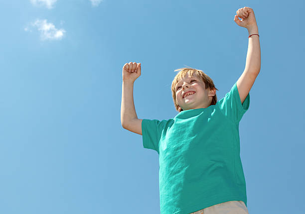 istock Happy boy football fan on sky background 141943997